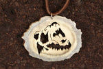 Intricately detailed roaring bear pendant hand crafted out of moose antler. The blade was attached and removed 14 times to finish this Bear Spirit pendant. Size: 2"x 2.5"