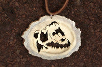 Intricately detailed roaring bear pendant hand crafted out of moose antler. The blade was attached and removed 14 times to finish this Bear Spirit pendant. Size: 2"x 2.5"