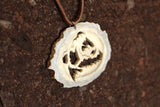 Intricately detailed roaring bear pendant hand crafted out of moose antler. The blade was attached and removed 14 times to finish this Bear Spirit pendant. Size: 2"x 2.5"